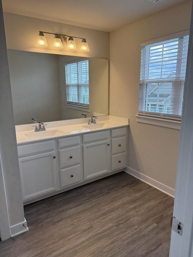 1840 Tall Oaks Dr, Antioch, IL 60002 - full bath with wood finished floors, double vanity, and baseboards