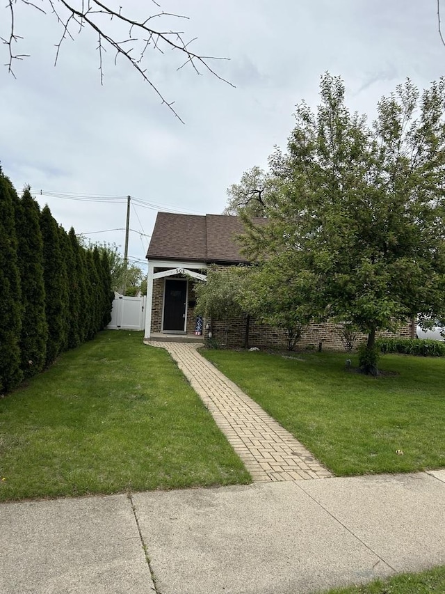 view of front of house with roof with shingles