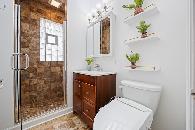 full bathroom with a shower stall, toilet, and vanity