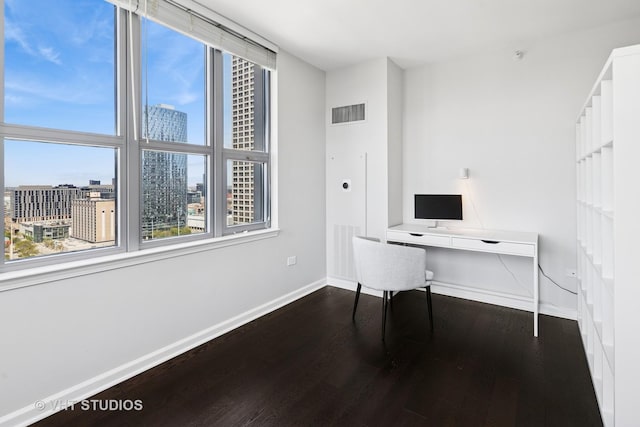 home office with wood finished floors and baseboards