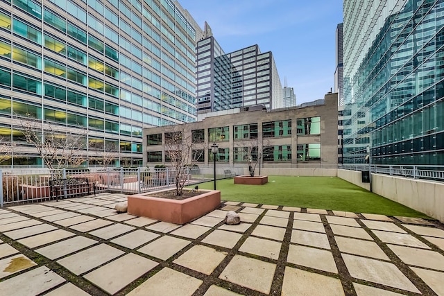 view of community with a patio area and a view of city
