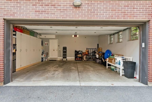 garage featuring baseboards and a garage door opener
