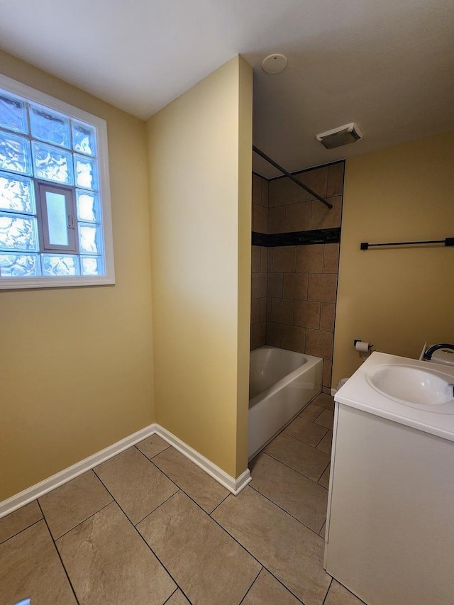 full bathroom featuring visible vents, shower / bathtub combination, baseboards, vanity, and tile patterned flooring