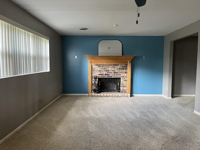 201 Meadows Rd S, Bourbonnais, IL 60914 - unfurnished living room with carpet floors, a brick fireplace, and baseboards