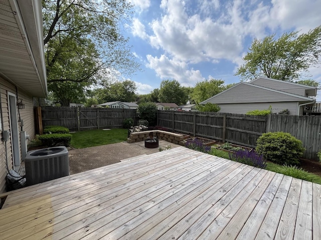 201 Meadows Rd S, Bourbonnais, IL 60914 - wooden deck with central air condition unit, a fenced backyard, and a patio area