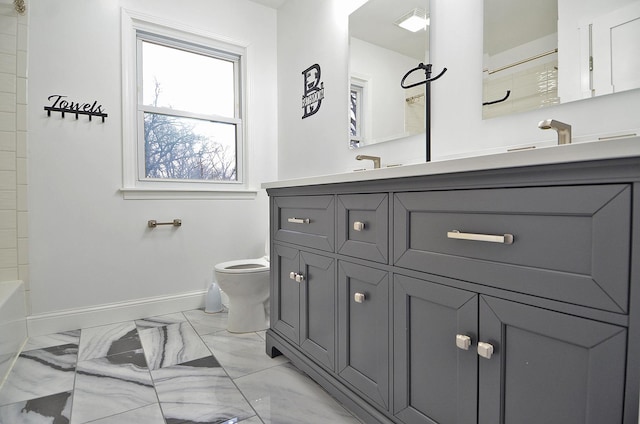 full bathroom with toilet, marble finish floor, vanity, and baseboards