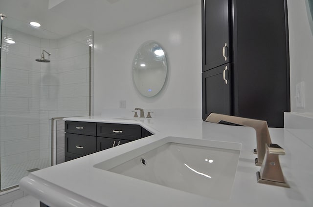 full bathroom featuring vanity and a stall shower