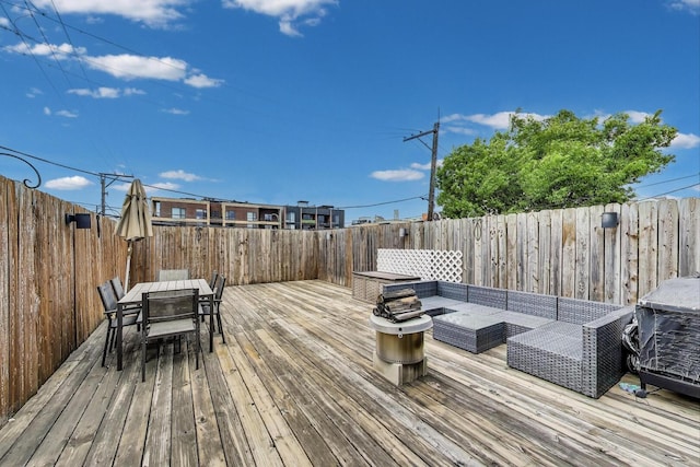 512 N Claremont Ave Unit 2, Chicago, IL 60612 - deck featuring an outdoor living space, a fenced backyard, and outdoor dining area