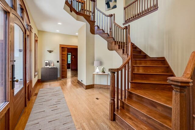 4019 Howard Ave, Western Springs, IL 60558 - entrance foyer with wood finished floors, stairway, plenty of natural light, recessed lighting, and a high ceiling