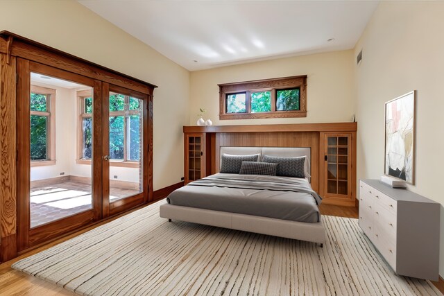 4019 Howard Ave, Western Springs, IL 60558 - bedroom featuring multiple windows, wood finished floors, and french doors