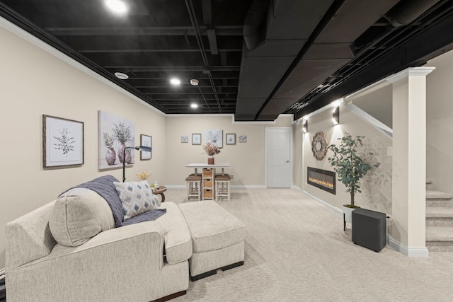 living area featuring stairway, carpet floors, and baseboards