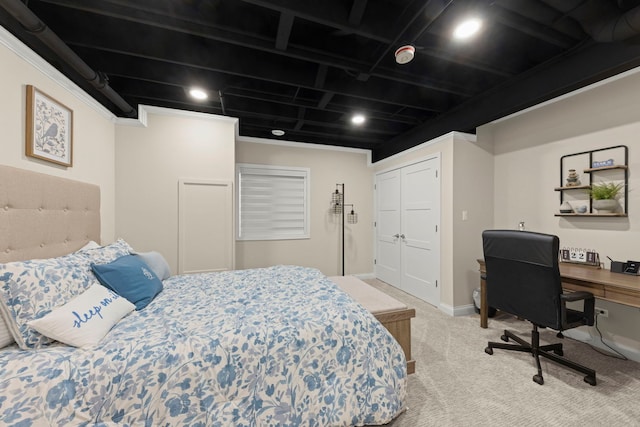 carpeted bedroom with baseboards and a closet