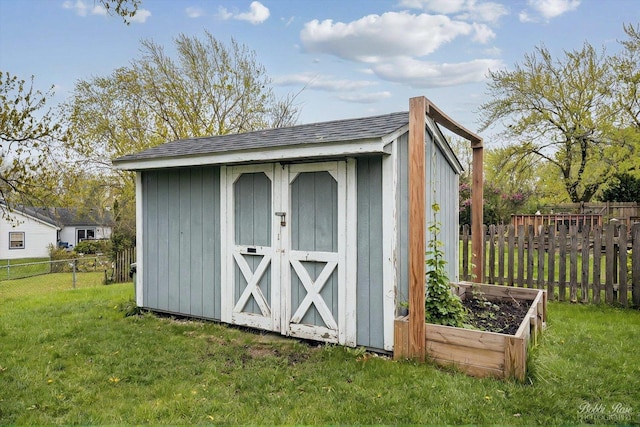view of shed with a fenced backyard
