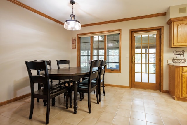 dining area featuring ornamental molding, baseboards, and visible vents