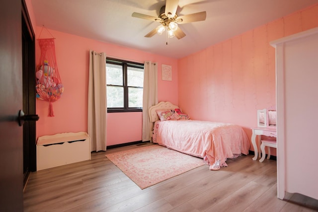 bedroom with a ceiling fan and light wood finished floors