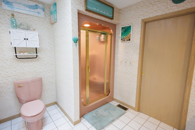 full bathroom featuring tile patterned floors, toilet, visible vents, and a shower stall