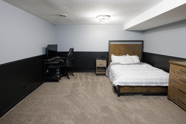 carpeted bedroom featuring a textured ceiling
