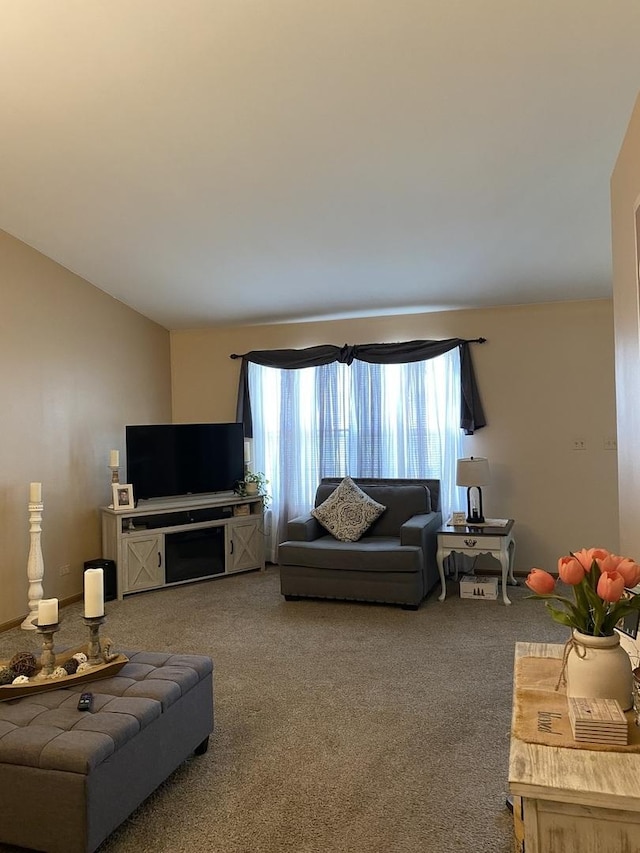 carpeted living room with vaulted ceiling
