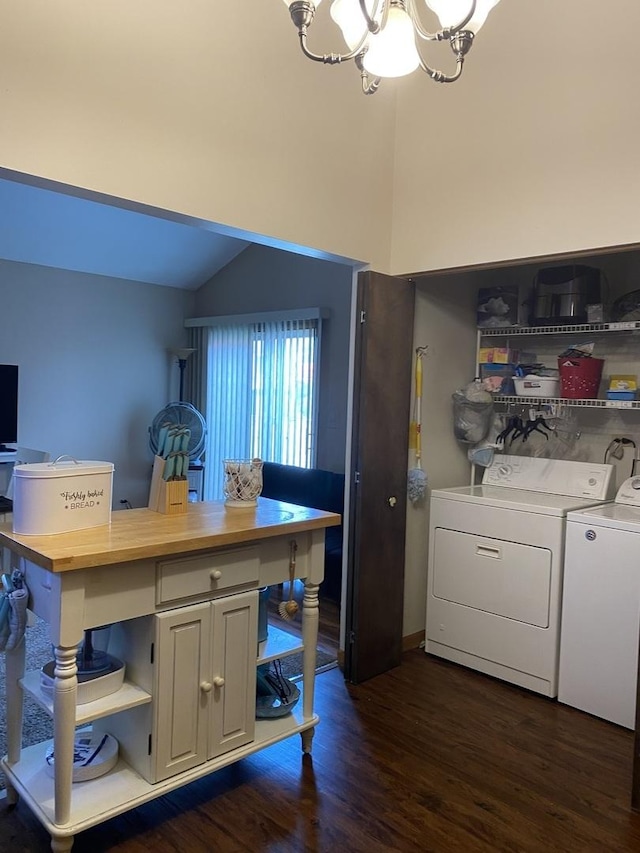 laundry room with washer and dryer, a notable chandelier, dark wood-style flooring, and laundry area