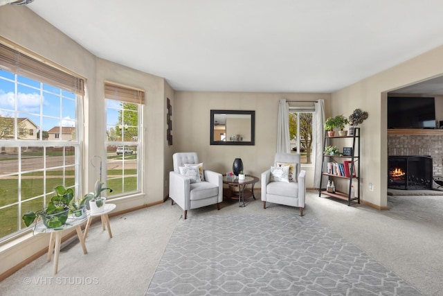 244 Tammanny Ln, Romeoville, IL 60446 - sitting room featuring carpet floors, a fireplace, and baseboards