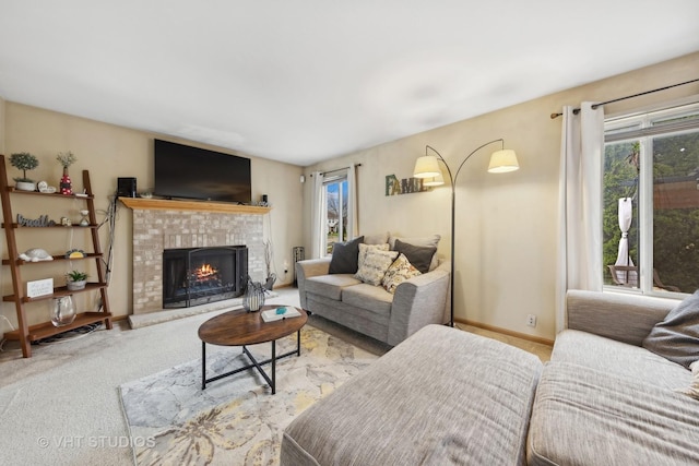 244 Tammanny Ln, Romeoville, IL 60446 - living area with carpet flooring, a brick fireplace, and baseboards