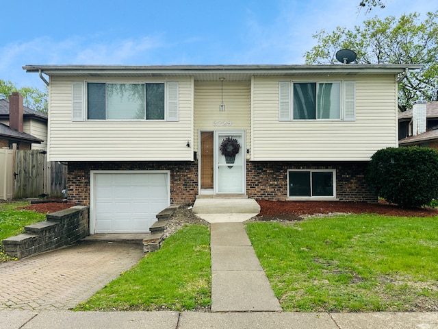 3729 W 121st St, Alsip, IL 60803 - split foyer home with driveway, a front yard, a garage, brick siding, and fence
