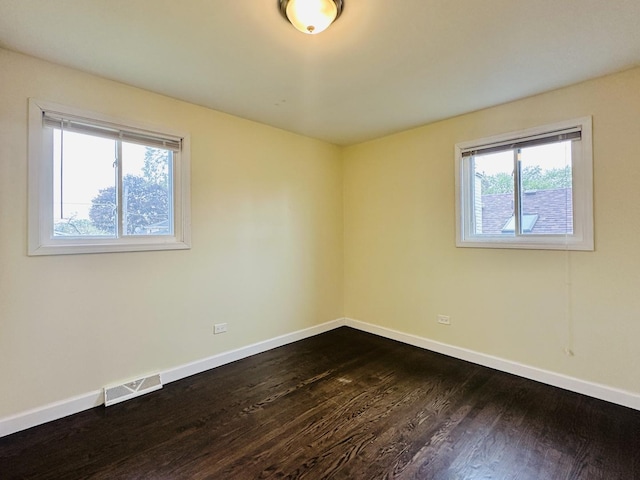 3729 W 121st St, Alsip, IL 60803 - spare room with visible vents, dark wood-style flooring, and baseboards