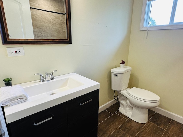 3729 W 121st St, Alsip, IL 60803 - bathroom with baseboards, wood tiled floor, toilet, and vanity