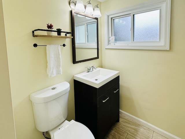 3729 W 121st St, Alsip, IL 60803 - half bathroom with vanity, baseboards, and toilet