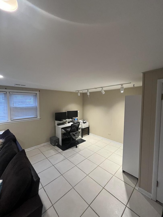 home office featuring track lighting and light tile patterned floors