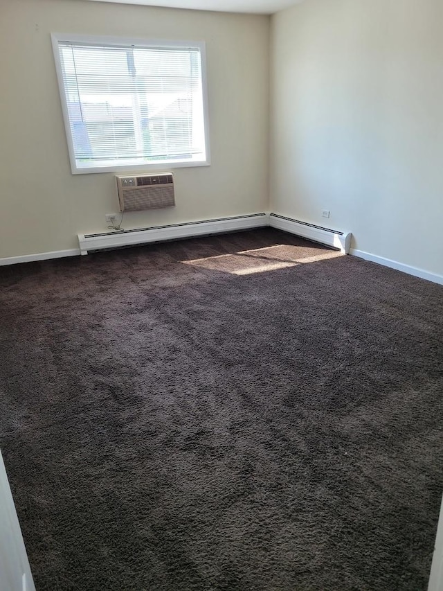 277 Shorewood Dr Unit 2A, Glendale Heights, IL 60139 - empty room featuring dark colored carpet, a baseboard radiator, an AC wall unit, and baseboards
