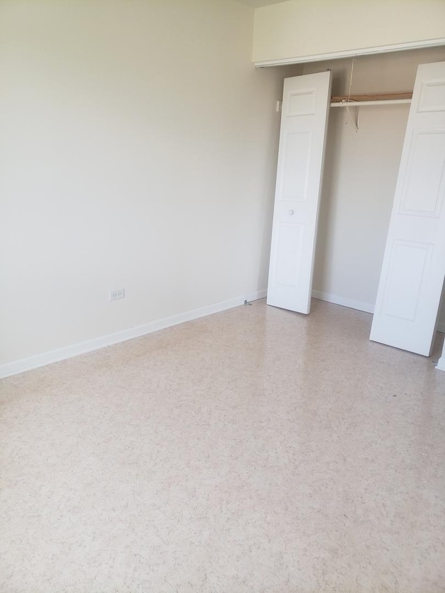 277 Shorewood Dr Unit 2A, Glendale Heights, IL 60139 - unfurnished bedroom with a closet and baseboards