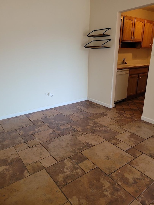 277 Shorewood Dr Unit 2A, Glendale Heights, IL 60139 - unfurnished dining area with baseboards, stone finish floor, and a sink