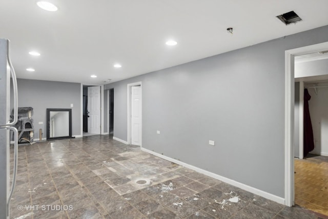 3553 W 77th St, Chicago, IL 60652 - below grade area featuring visible vents, recessed lighting, freestanding refrigerator, and baseboards