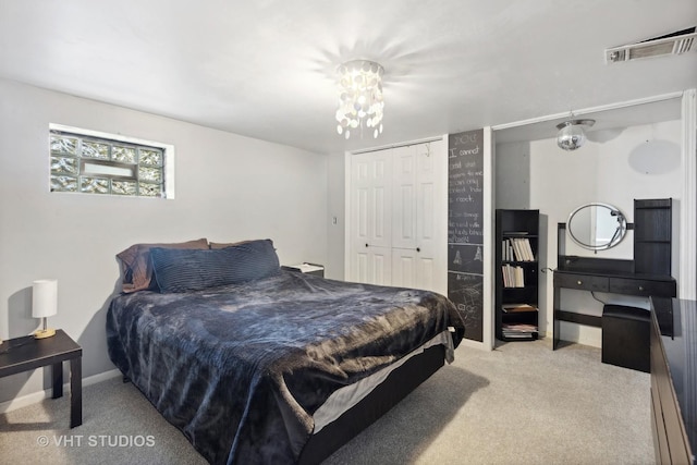 3553 W 77th St, Chicago, IL 60652 - carpeted bedroom with a closet, visible vents, an inviting chandelier, and baseboards