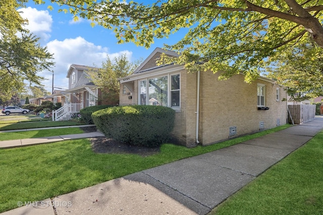 3553 W 77th St, Chicago, IL 60652 - view of front of home featuring brick siding, a front yard, and crawl space
