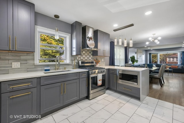 3553 W 77th St, Chicago, IL 60652 - kitchen with a peninsula, stainless steel appliances, marble finish floor, a sink, and wall chimney exhaust hood