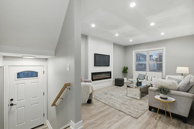 9221 S Lowe Ave, Chicago, IL 60620 - living room with recessed lighting, a glass covered fireplace, wood finished floors, and baseboards