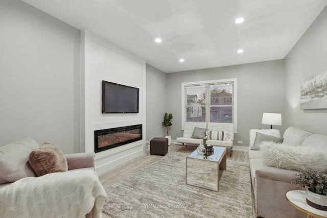 9221 S Lowe Ave, Chicago, IL 60620 - living area featuring baseboards, recessed lighting, wood finished floors, and a glass covered fireplace