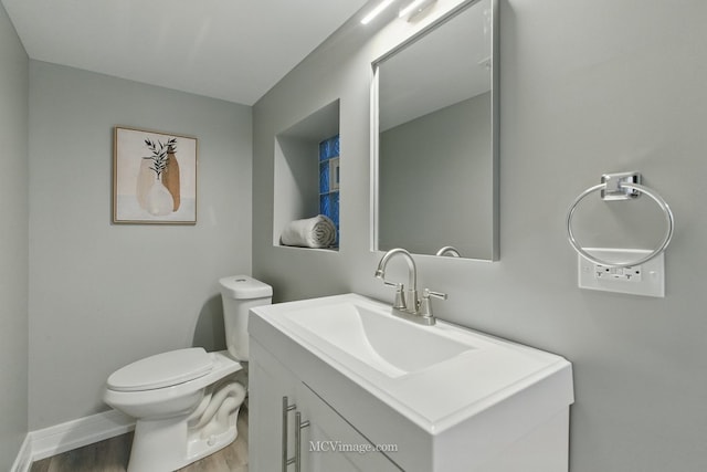 9221 S Lowe Ave, Chicago, IL 60620 - bathroom with toilet, vanity, and wood finished floors