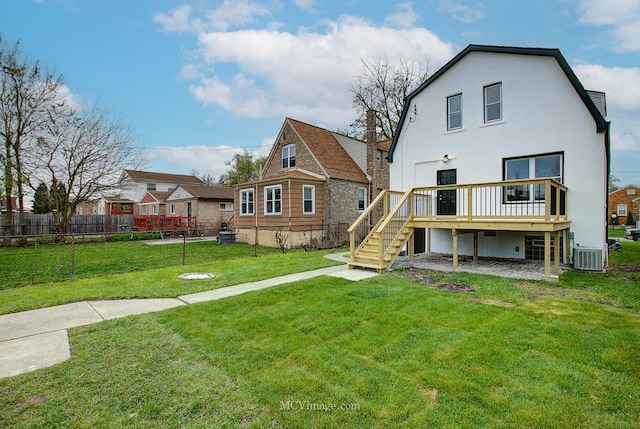 9221 S Lowe Ave, Chicago, IL 60620 - rear view of property with a deck, fence, stairway, a yard, and central AC