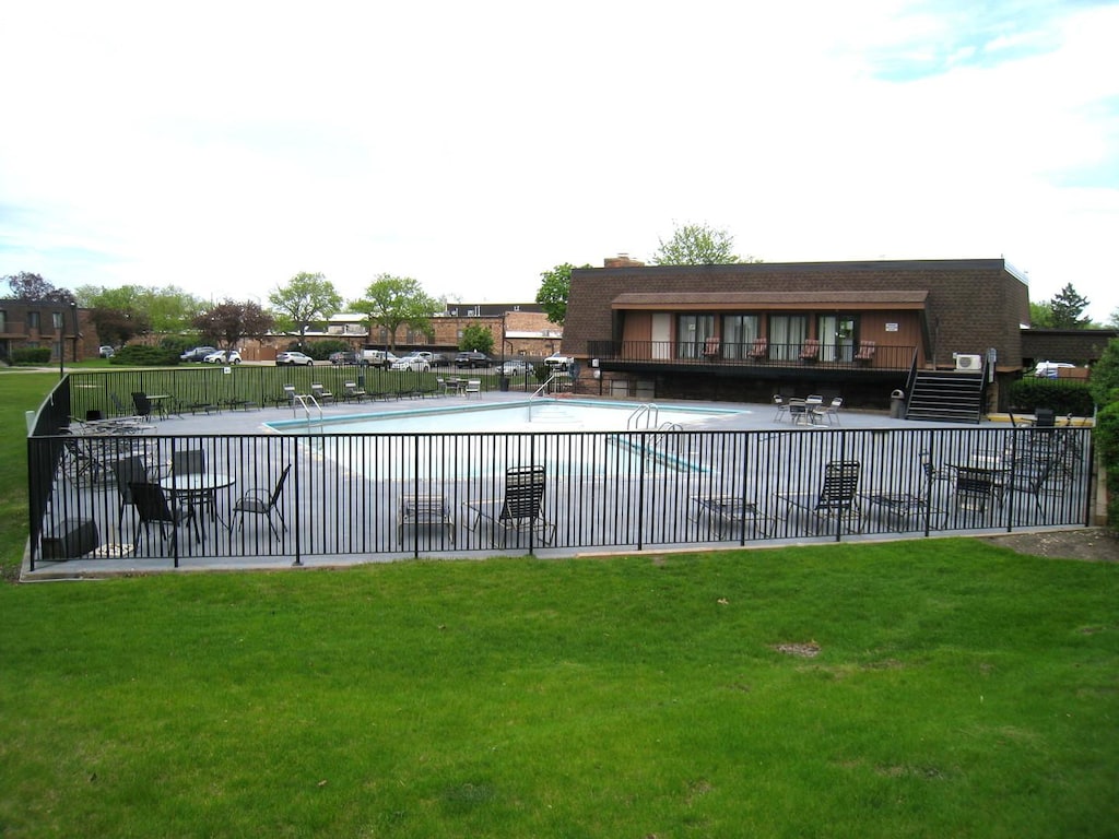 community pool featuring a patio area
