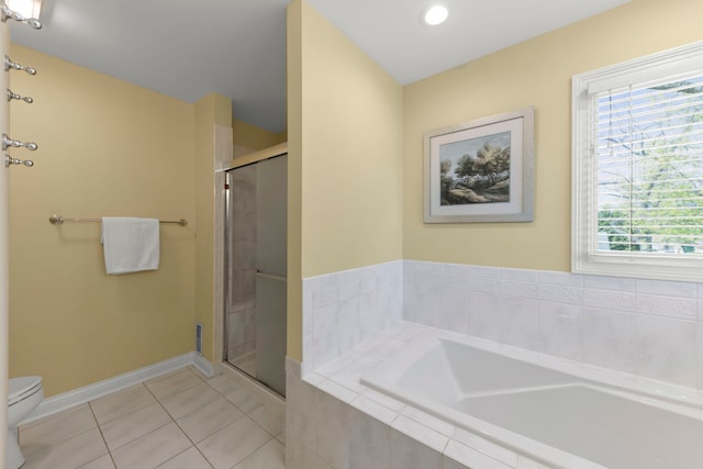 569 Prairie Ave, Glen Ellyn, IL 60137 - bathroom featuring toilet, tile patterned floors, a shower stall, a bath, and baseboards