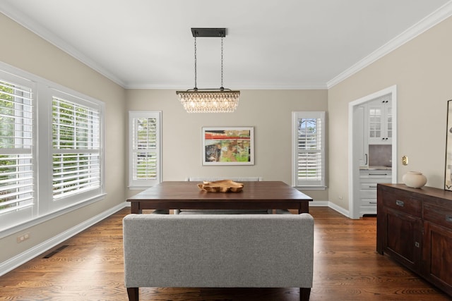 569 Prairie Ave, Glen Ellyn, IL 60137 - dining room featuring crown molding, baseboards, a chandelier, and dark wood-type flooring