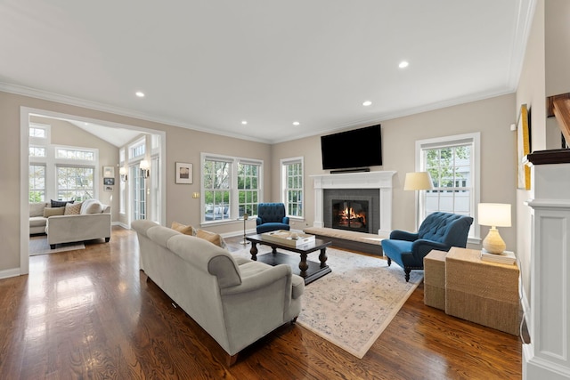 569 Prairie Ave, Glen Ellyn, IL 60137 - living room with a brick fireplace, plenty of natural light, dark wood-style floors, recessed lighting, and ornamental molding