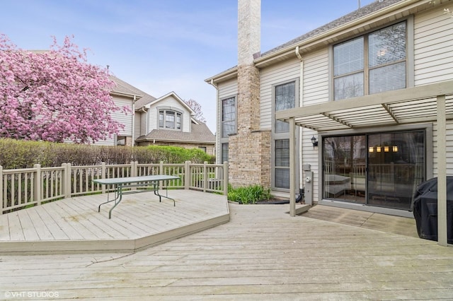 wooden deck featuring a pergola