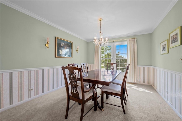 dining area featuring carpet flooring, crown molding, and a notable chandelier