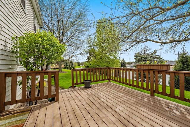 deck featuring a lawn