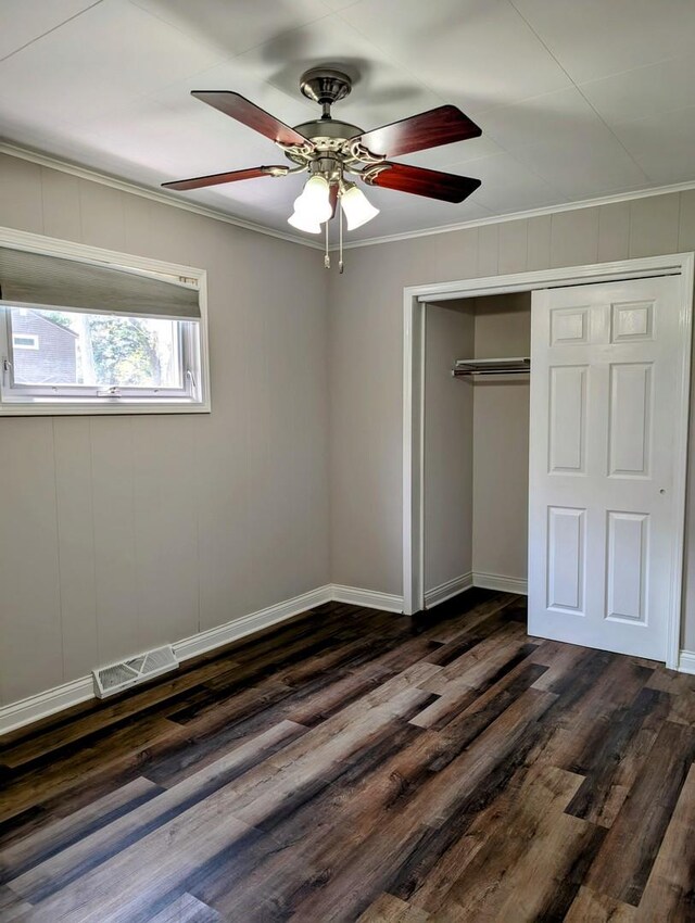 1514 173rd St, East Hazel Crest, IL 60429 - unfurnished bedroom featuring ornamental molding, dark wood finished floors, a closet, baseboards, and a ceiling fan