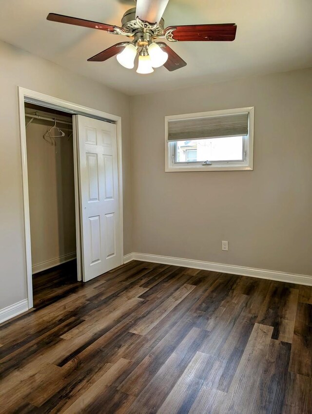 1514 173rd St, East Hazel Crest, IL 60429 - unfurnished bedroom featuring dark wood-type flooring, a closet, baseboards, and a ceiling fan